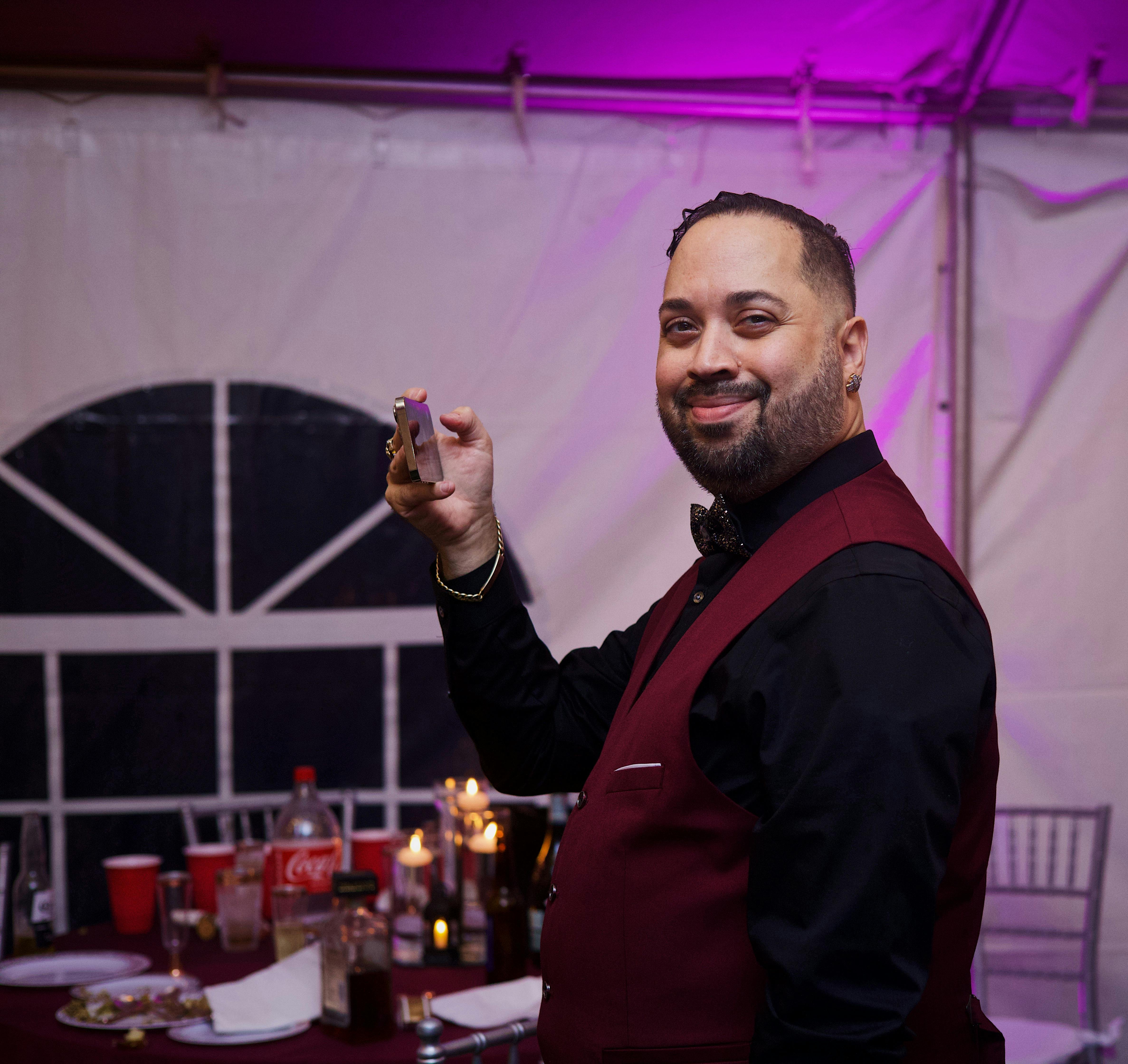 Server in Black Long Sleeves and Maroon Vest