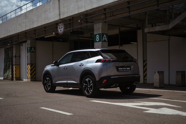 Silver Peugeot On Car Park