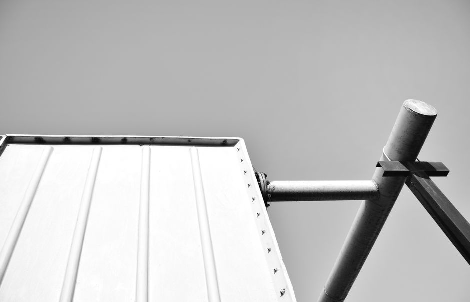 Black and white image of a modern steel structure showcasing minimalism and abstract design.