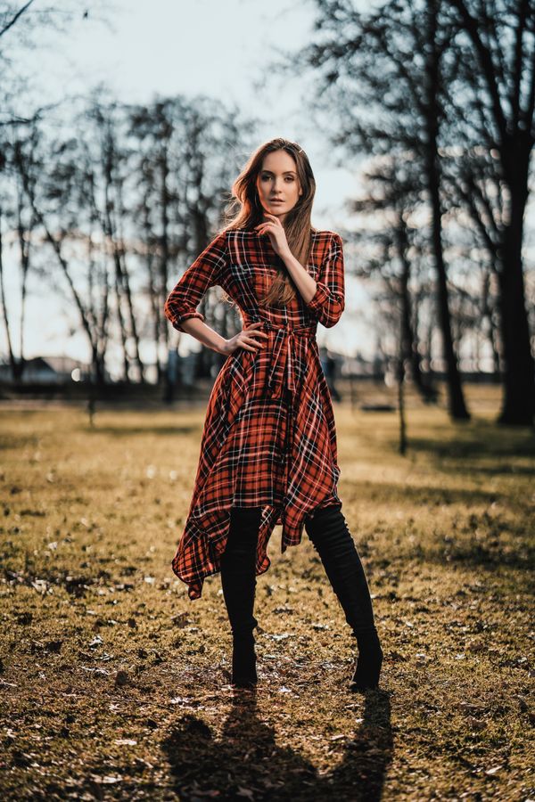woman in plaid maxi skirt with black ankle boots at a winter market
