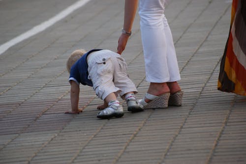 Free stock photo of dropped, mother and child, raised arm