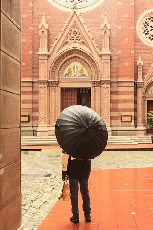 A Person Holding a Brown Umbrella