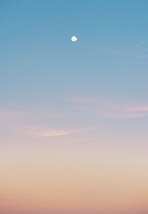 Free Serene pastel sky with full moon at twilight, creating a peaceful atmosphere. Stock Photo