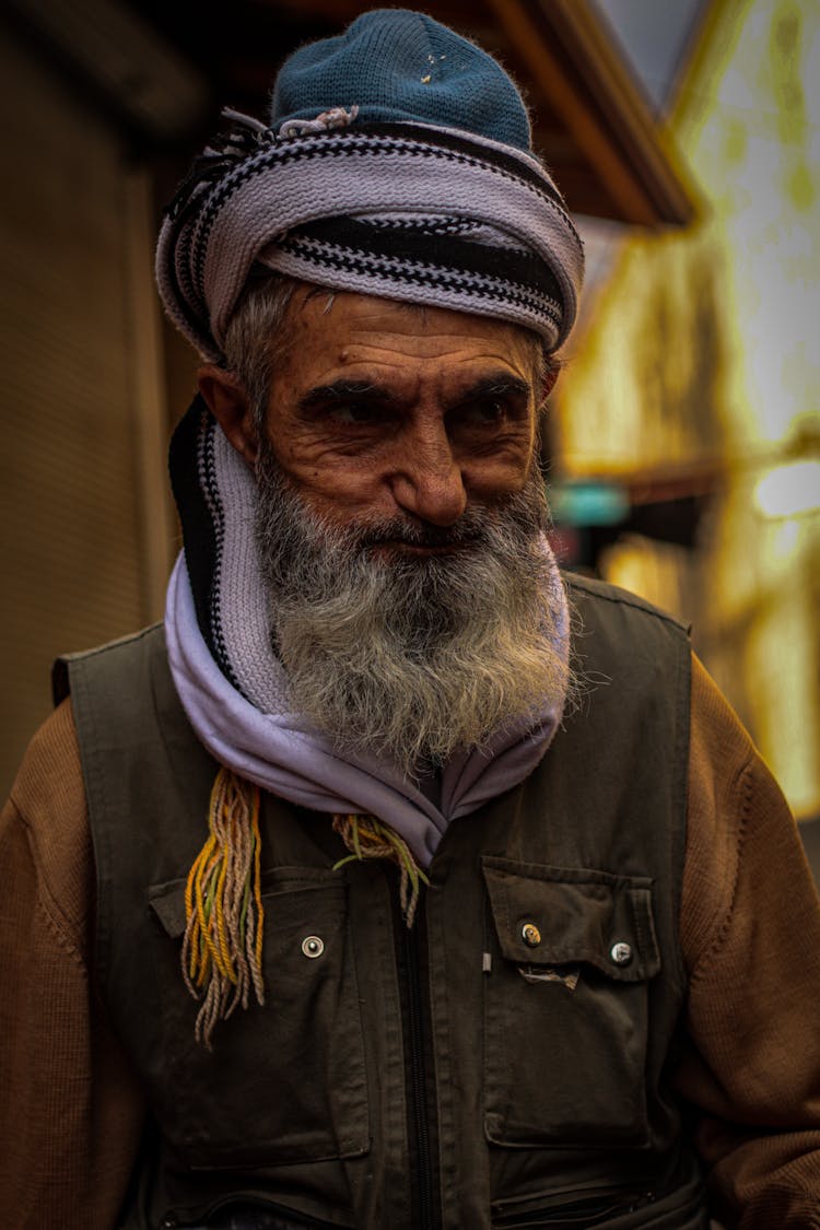 A Bearded Man Wearing A Beanie And A Scarf