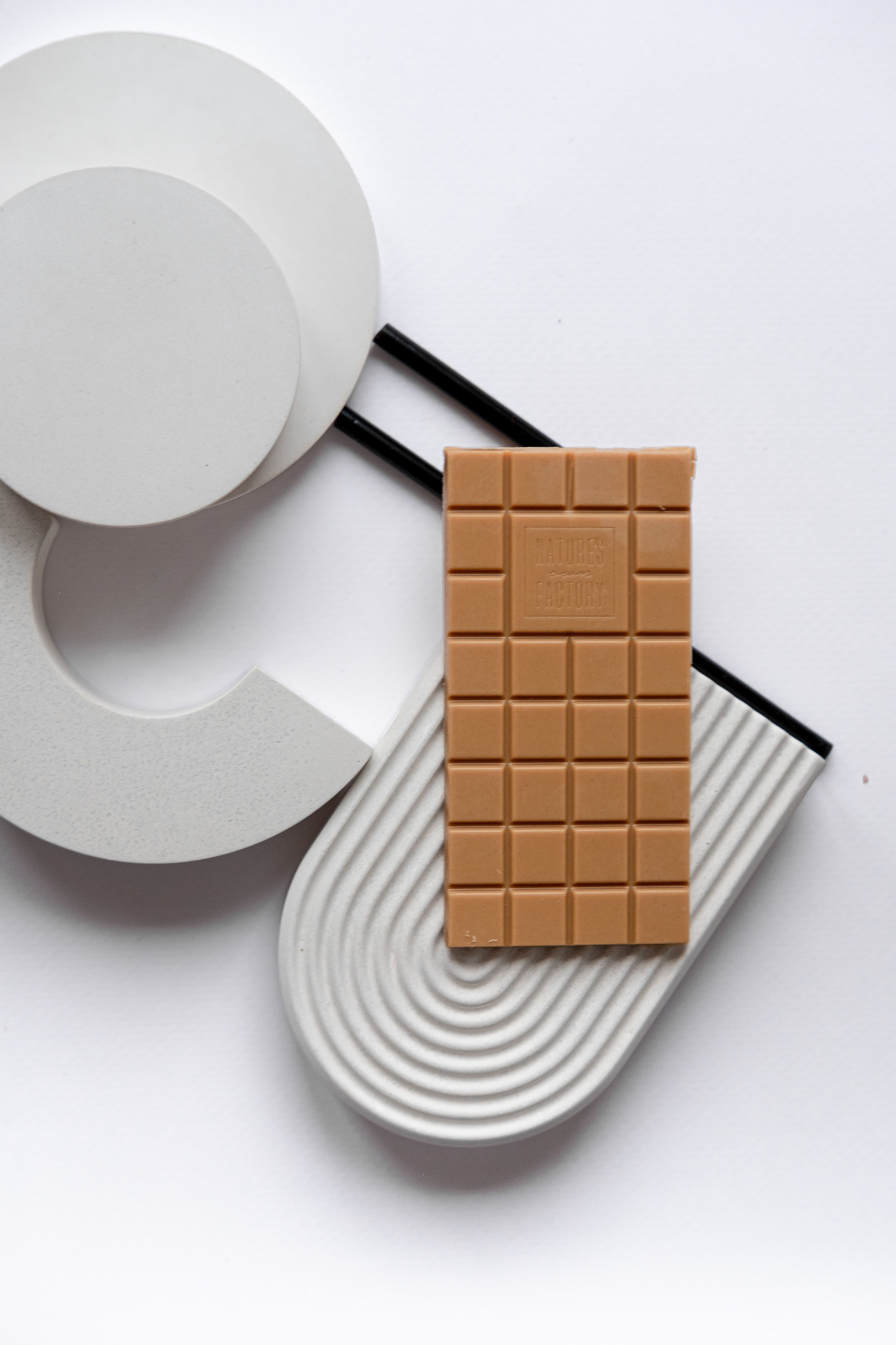 White Chocolate on Geometric Shapes · Free Stock Photo