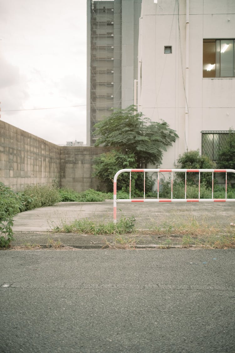 A Vacant Lot With A Barrier