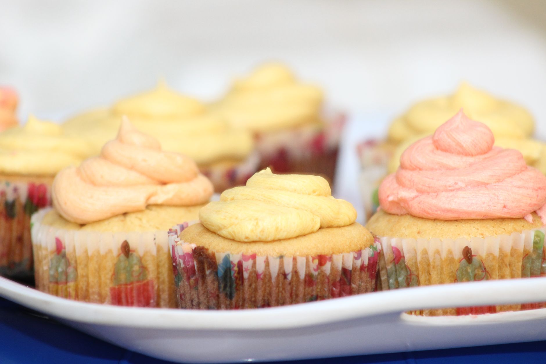 Cupcakes with creamy mango buttercream and toasted almonds
