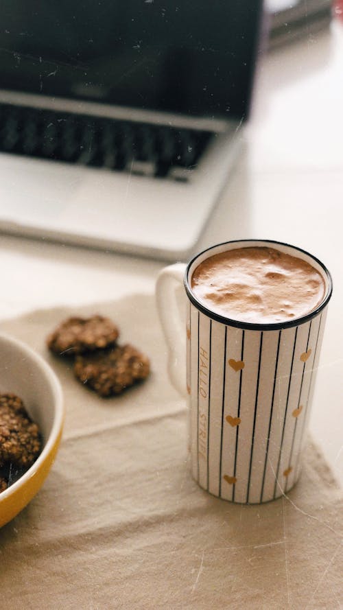 Free White Ceramic Mug With Coffee Beside Laptop Stock Photo