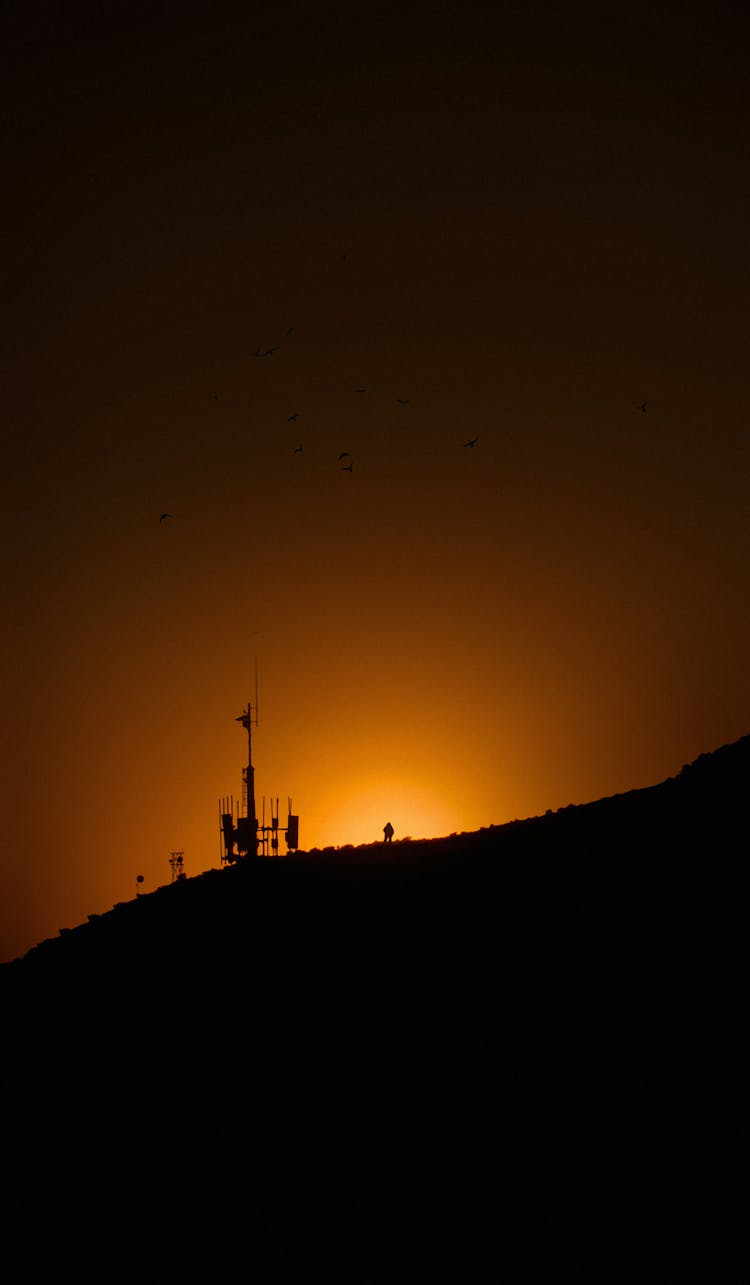 Silhouette Of Satellite In A Hillside