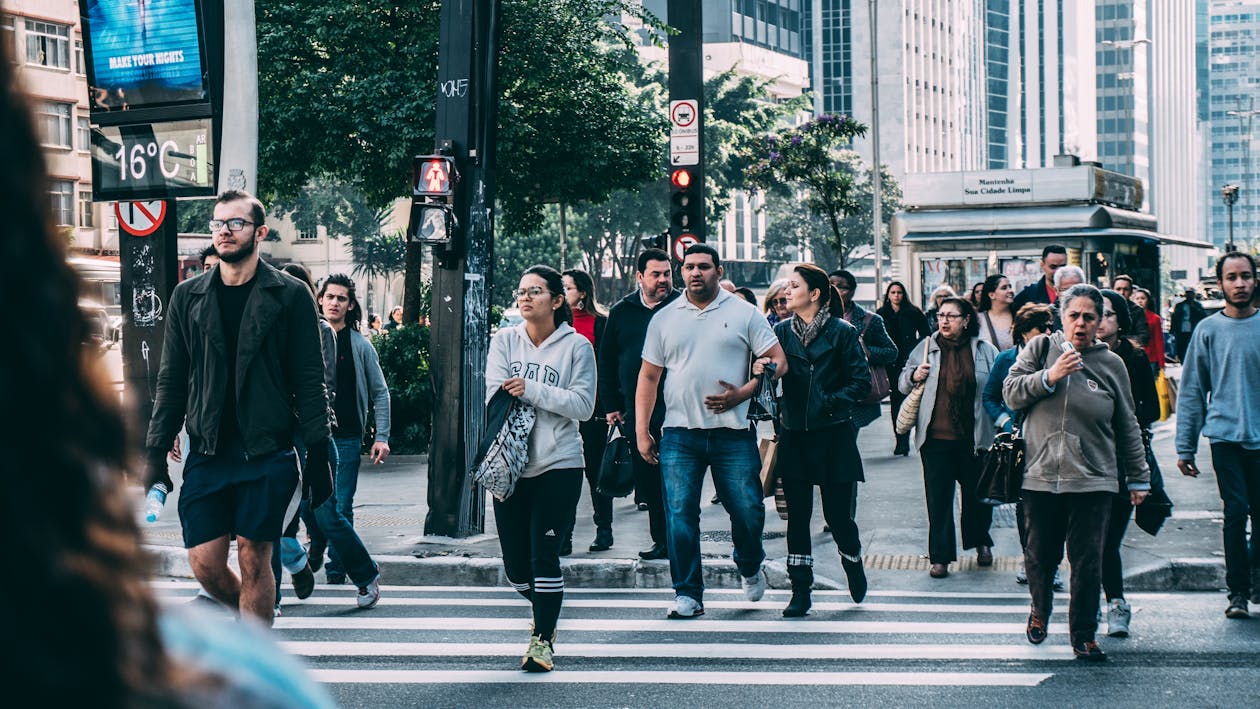 People Walking on Pedestrian Lane during Daytime