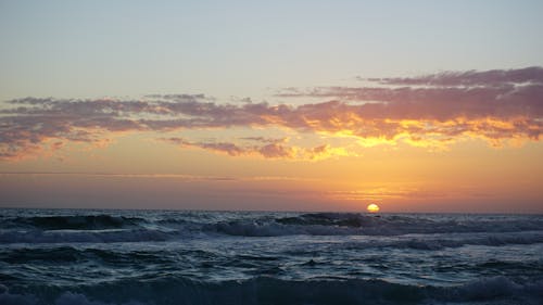 A View of the Sunset Over the Ocean