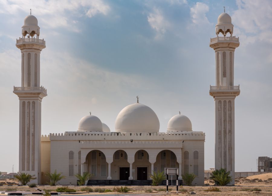 Beautiful mosque exterior in Umm Al Quwain, UAE, showcasing Islamic architecture.