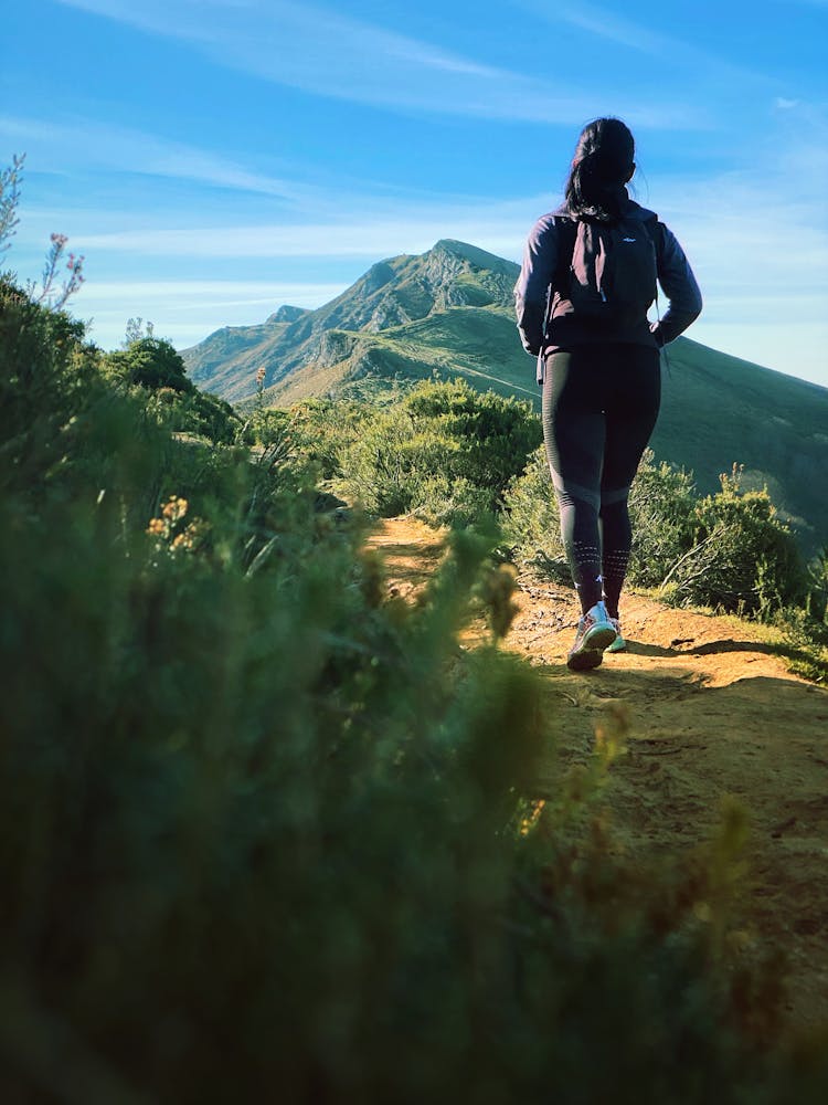 A Woman Hiking On A Mountain