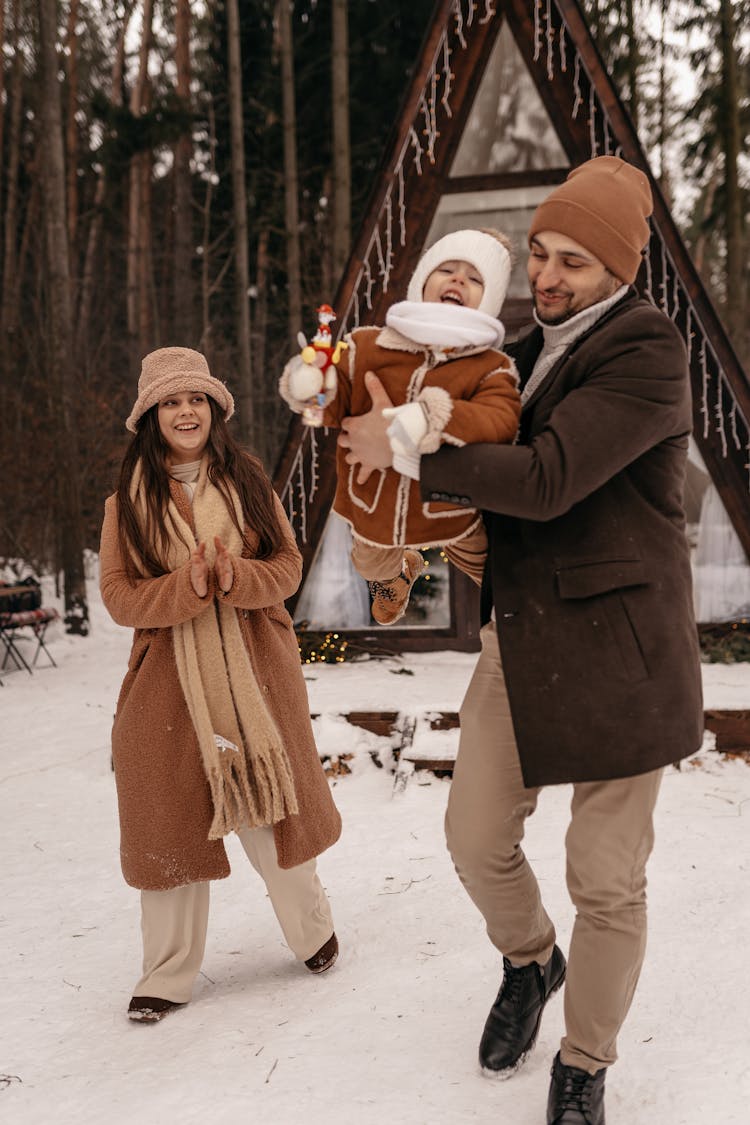 A Family In Winter Clothes