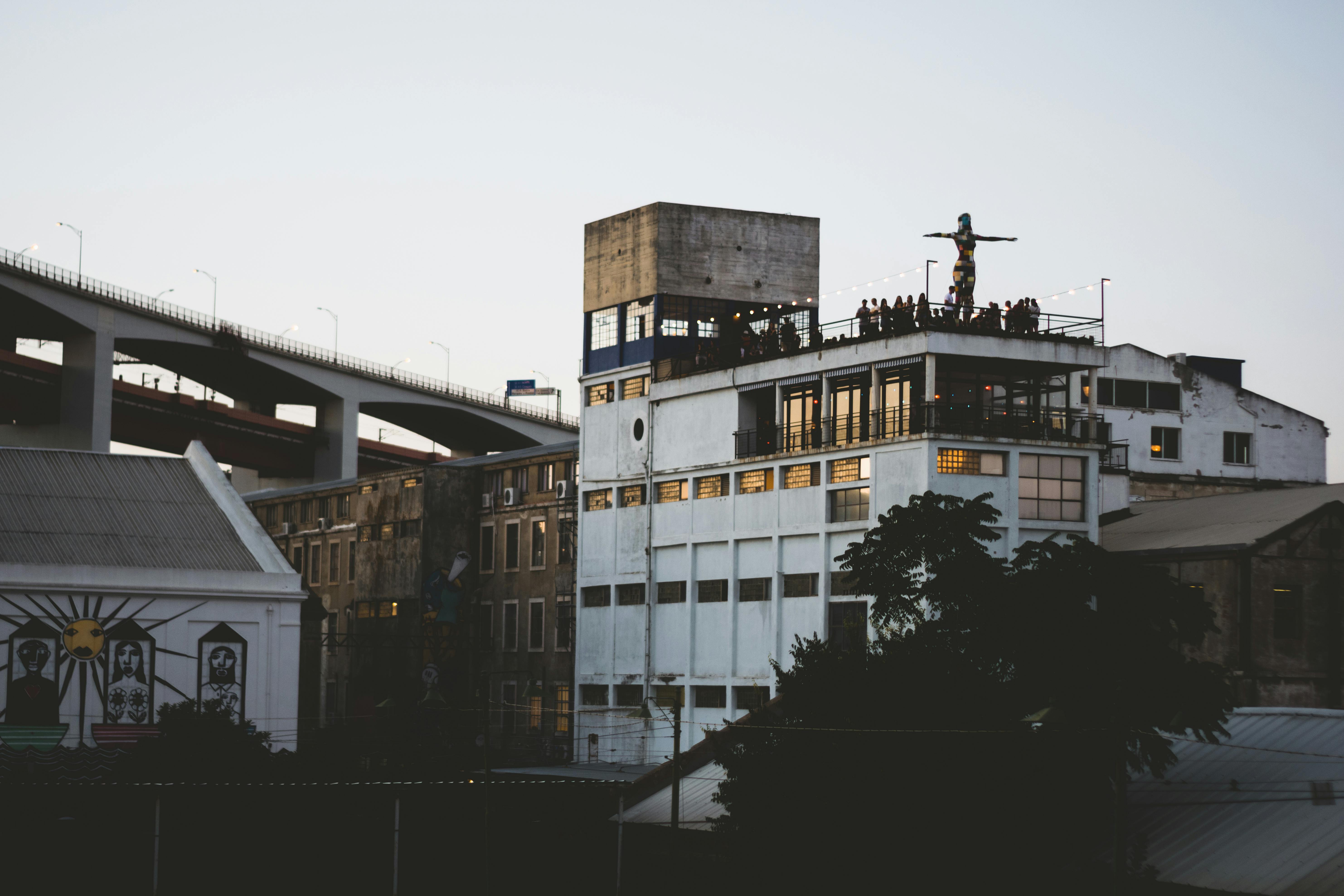 modern exterior or rooftop terrace of The Sally apartments at dusk - uptown chicago food delivery