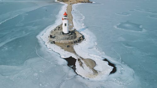 High Angle View of a Lighthouse on a Frozen Bay