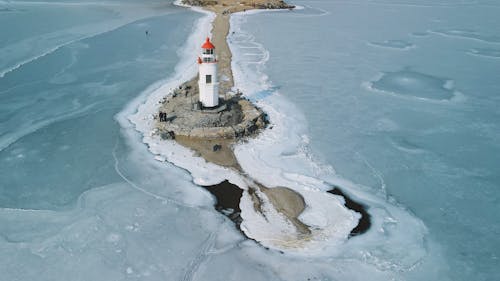 High Angle View of a Lighthouse on a Frozen Bay