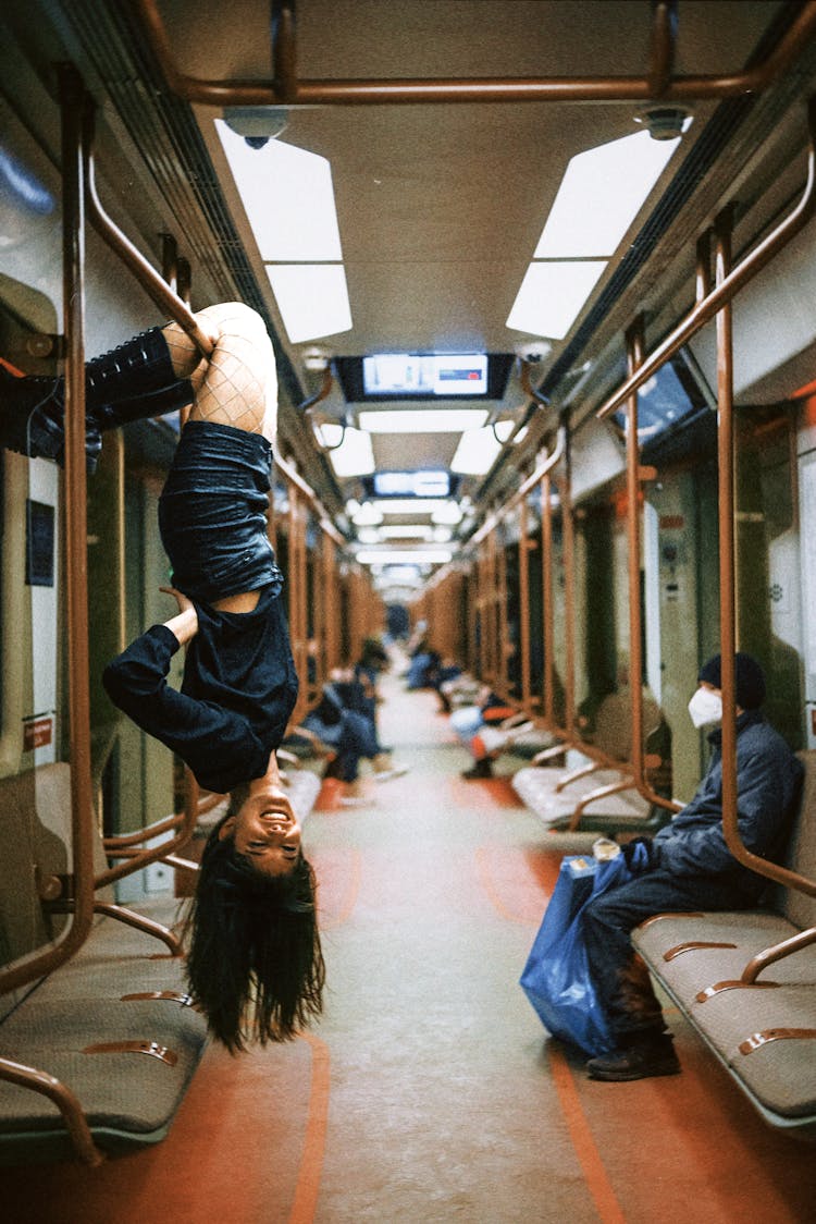 Woman Hanging Inside Subway Train