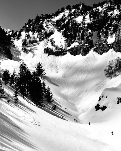 Black and White Photo of Mountain Covered with Snow