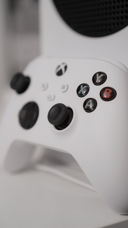 White Video Game Controller in Close Up Photography