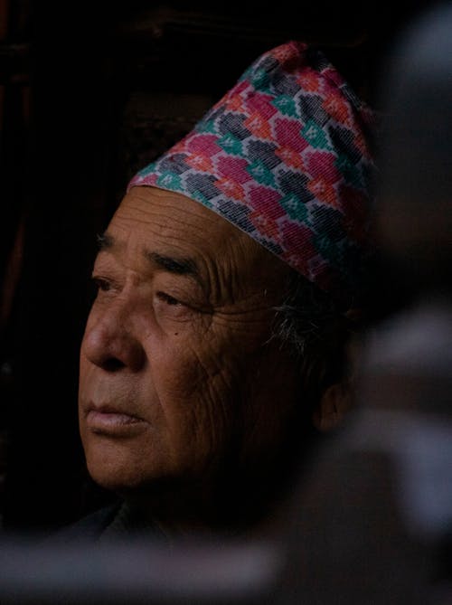 Portrait of a Senior Man in an Ornamental Traditional Hat