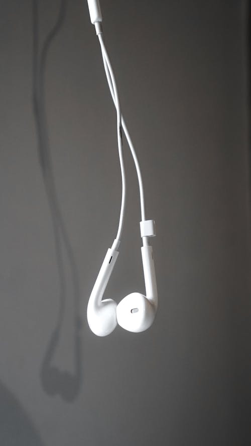 White Earbuds with Gray Background