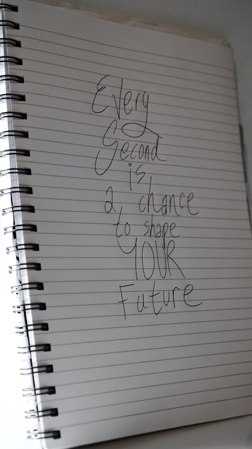 Free Motivational Message on a Notebook Page  Stock Photo
