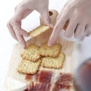 Person Holding Brown Wooden Chopping Board