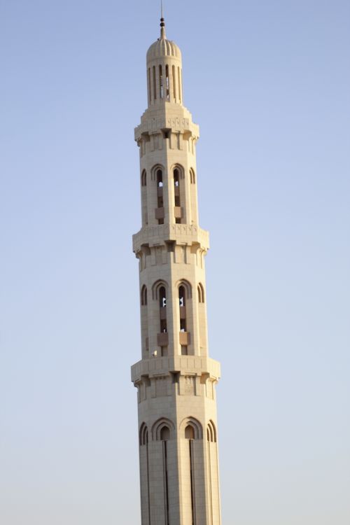 Free Stunning vertical shot of a minaret with intricate details against a clear blue sky. Stock Photo