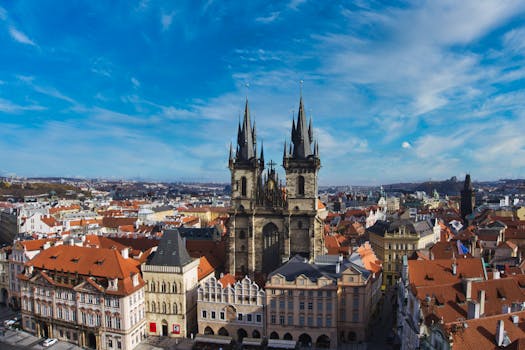 Explore the breathtaking aerial view of Prague with its historic church spires and charming rooftops.