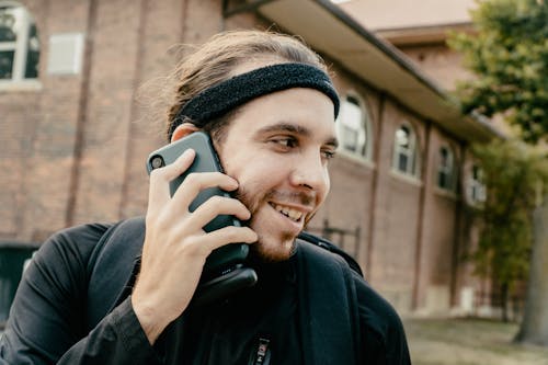 Close UP Photo of Man Talking on the Phone