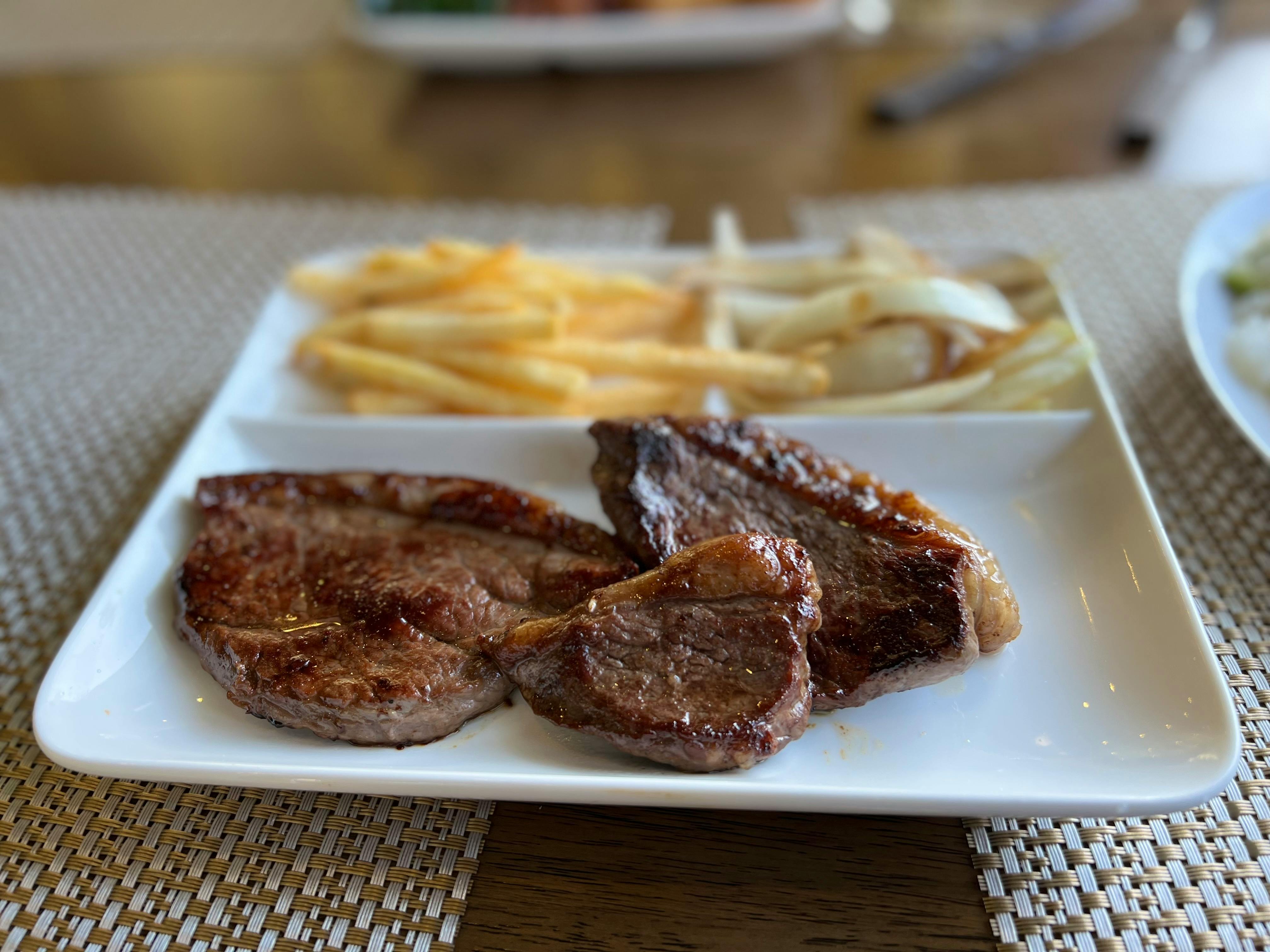 grilled meat on white ceramic plate