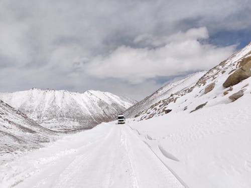 A Car on a Snow Covered Mountain