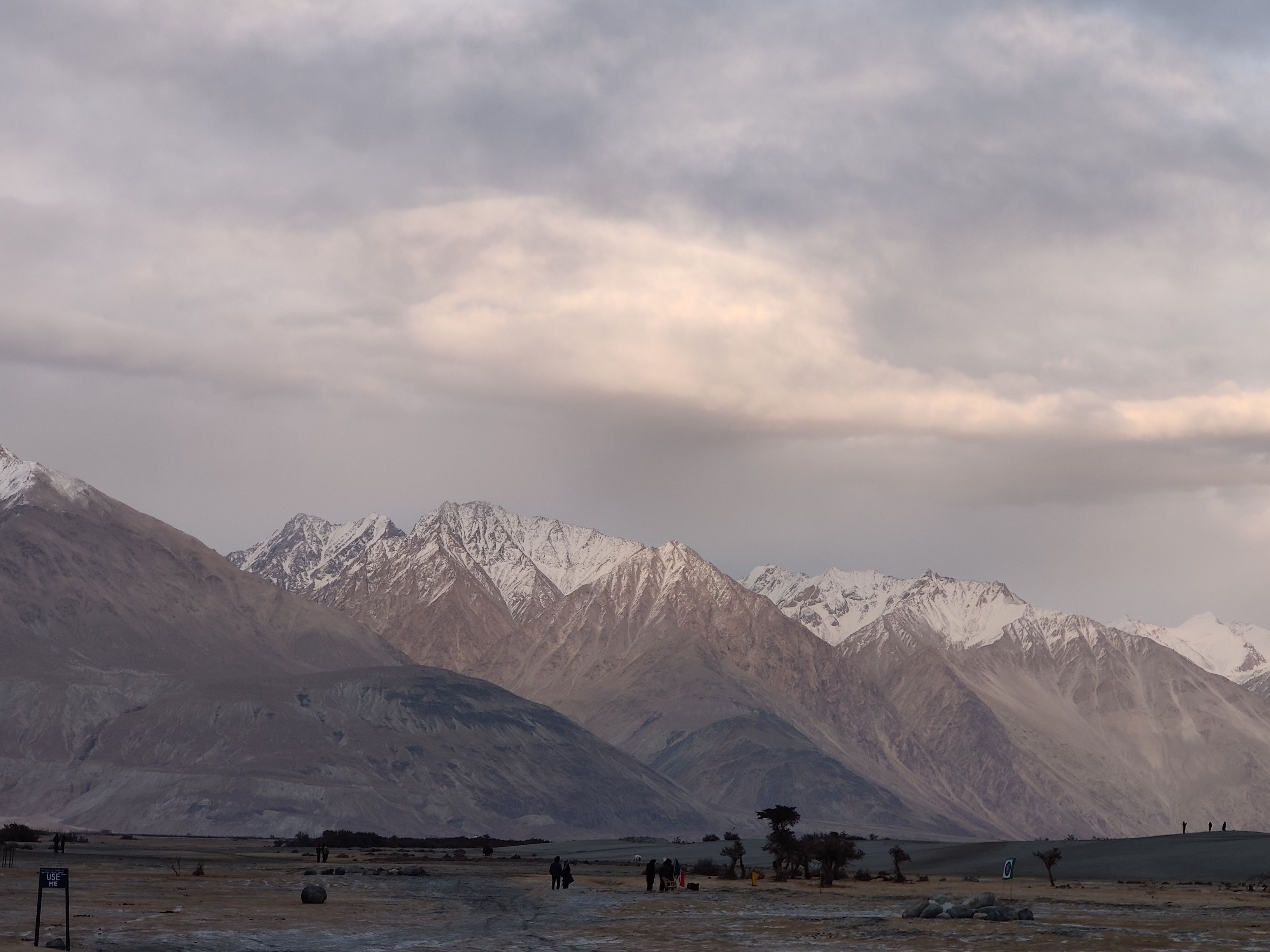 Snow Covered Mountains under Cloudy Sky · Free Stock Photo