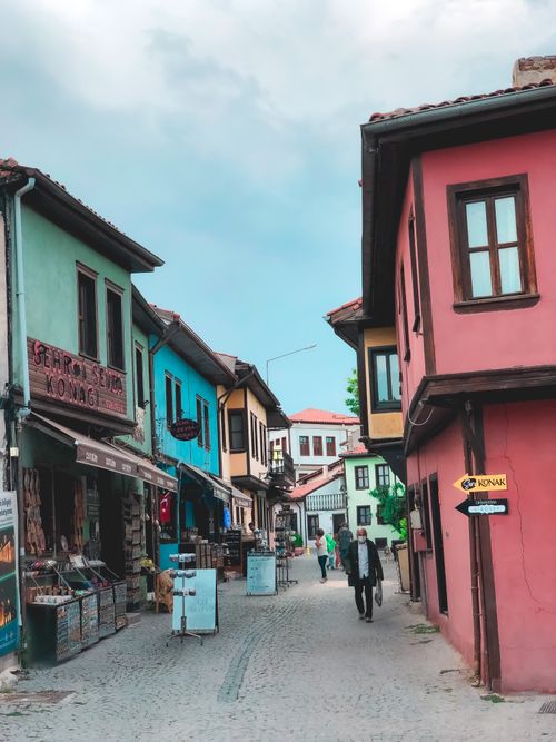 Free Vibrant street view of an old town with colorful traditional buildings and cobblestone paths. Stock Photo