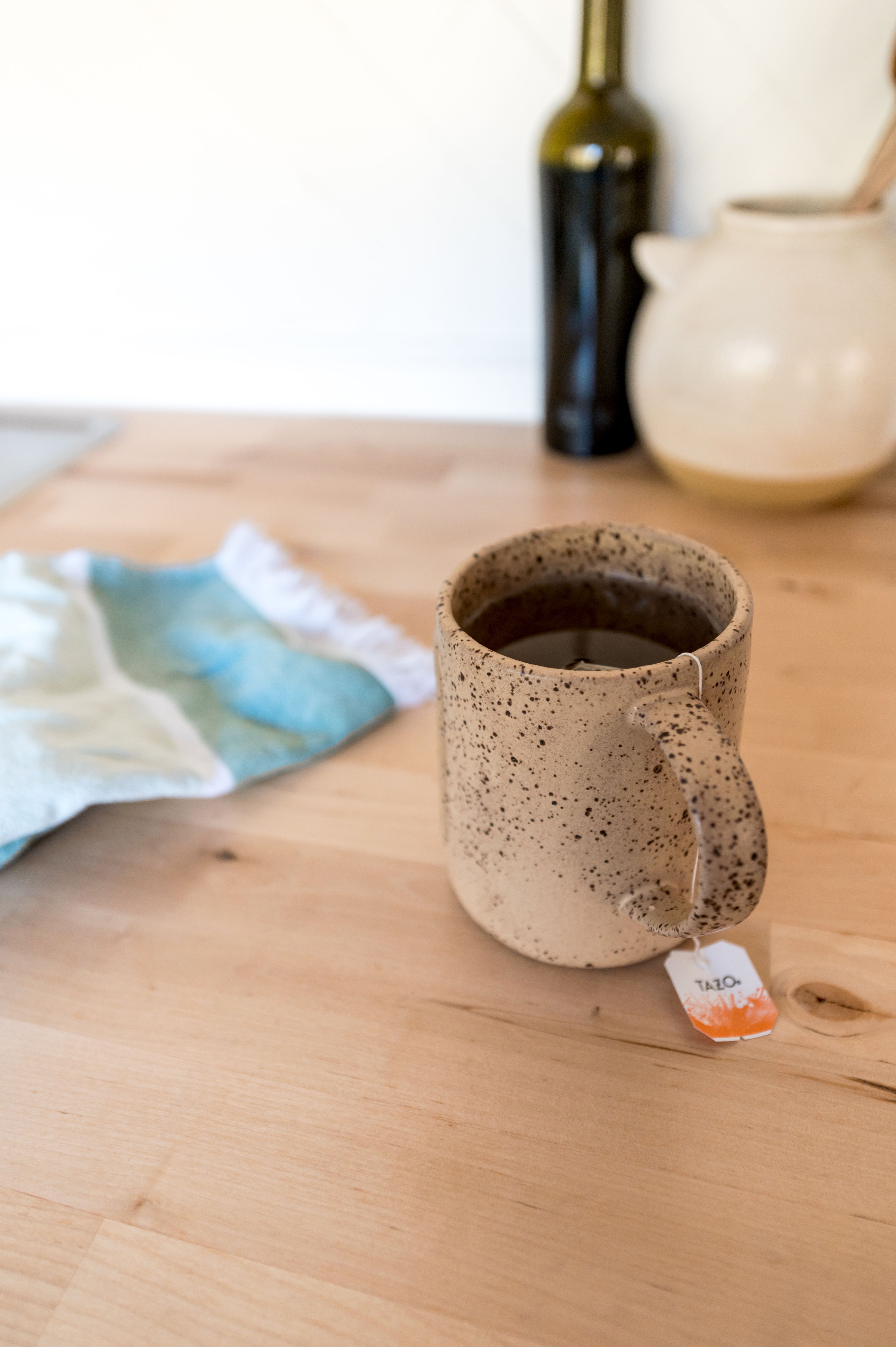 Speckled stoneware mug on white