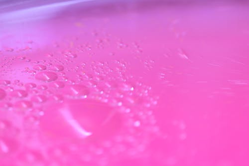 Water Droplets on a Pink Surface