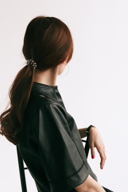 Premium Photo  Fashion photo of a beautiful elegant woman in black leather  dress on white background studio shot
