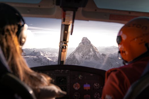 Breathtaking view of the Matterhorn from inside a helicopter cockpit during flight over the Swiss Alps.