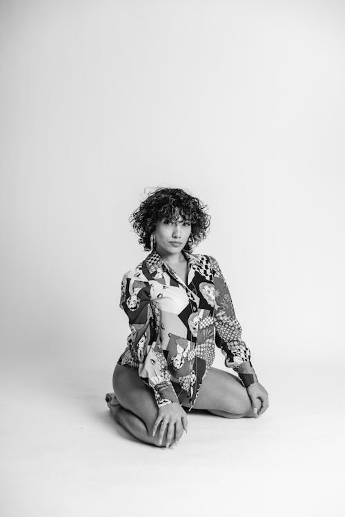 Woman with Curly Hair Posing on Studio Shoot