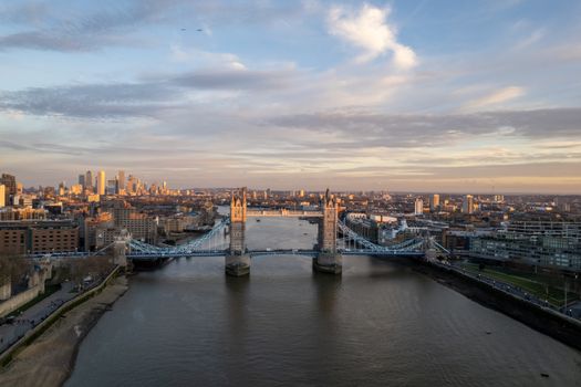 A breathtaking aerial shot of London's Tower Bridge with the city skyline at dusk.