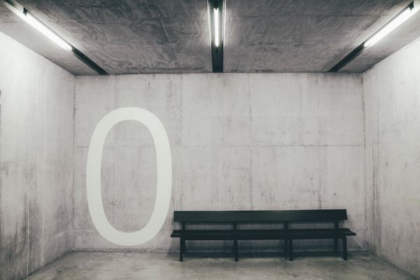 Concrete waiting room with bench — photo by Andrea De Santis on Pexels