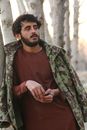 Man in Green and Brown Camouflage Jacket