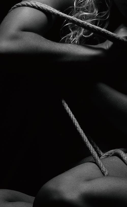 A Woman with her Body Tied up with a Rope 