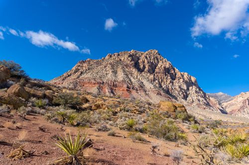 Free Beautiful view of Red Rock Canyon's rocky formations under a bright blue sky in Nevada. Stock Photo