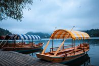 Brown Wooden Boats With Canopy on Dock