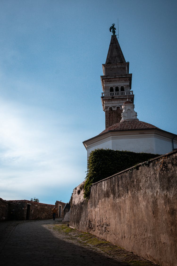 Tower Of The St. Georges Parish Church Above The Road, Piran, Slovenia 