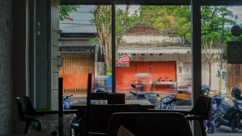 Window View of Motorbikes Standing Outside Cafeteria