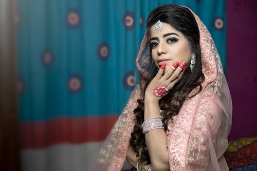 Brunette Woman Wearing Traditional Clothing and Makeup