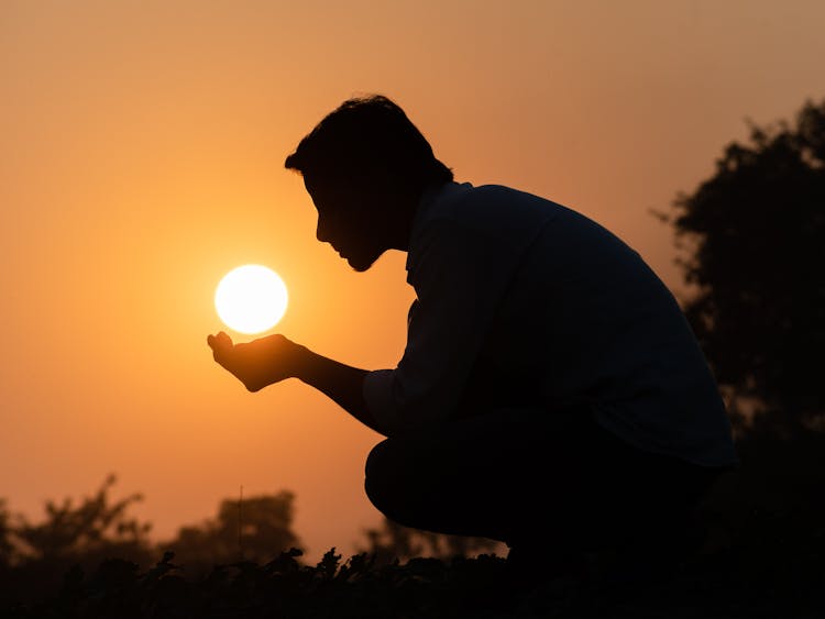 Silhouette Of A Man Crouching